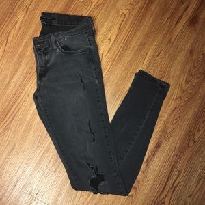 Flying monkey, black ripped jeans